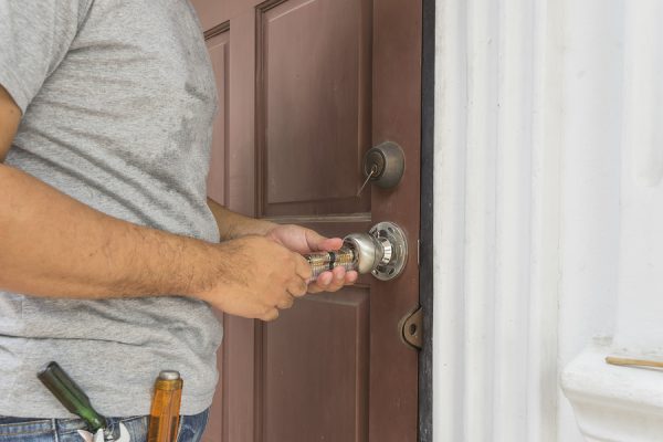 Locksmith opening wood door